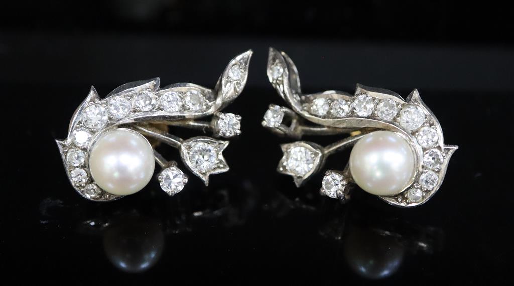 A pair of white gold, cultured pearl and diamond cluster set scroll earrings,